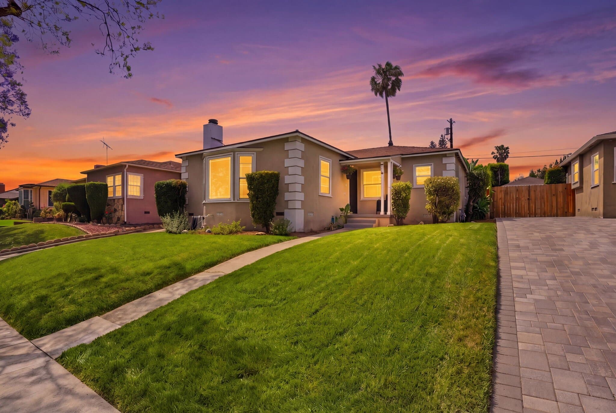 Orange County bungalow exterior at twilight, the kind of listing we run end to end